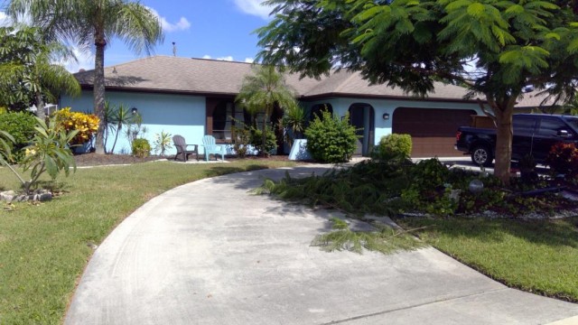3-bed single family at 703 WILDWOOD PKWY, Lee County FL — foreclosure auction