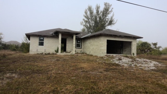 Vacant land at 1112 NW 28TH AVE, Lee County FL — foreclosure auction