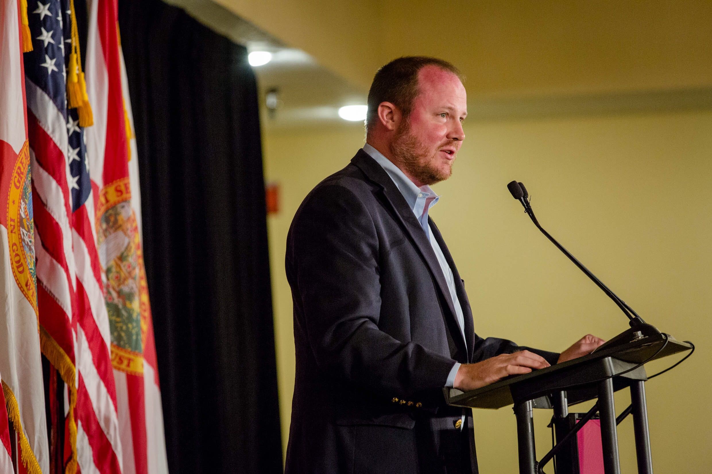 Matt Caldwell standing at podium